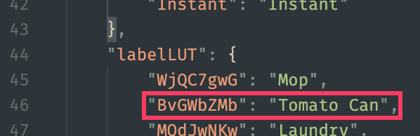 A screenshot of the dialog.loc file, showing a JSON structure where a section called "labelLUT" has a highlighted key "BvGWbZMb" with the value "Tomato Can"